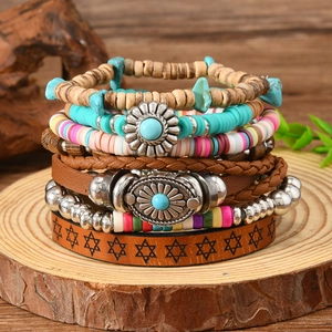 Detailed view of bohemian layered bracelet set with turquoise beads and sunburst charms