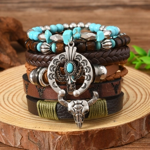 Close-up of bohemian leather bracelet featuring bull head charm and turquoise wood beads