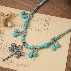 Bohemian turquoise bead necklace with silver dragonfly pendant and butterfly charms