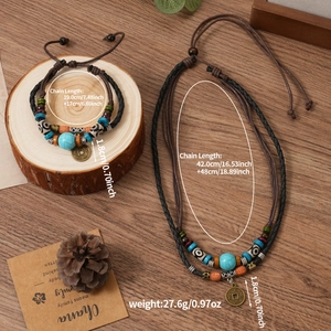 Detailed view of ethnic woven necklaces with turquoise beads and antique coins