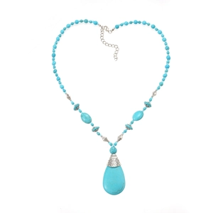 Bohemian turquoise beaded necklace with teardrop pendant on white background
