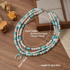 Three-layer bohemian necklace with faux pearls, turquoise beads and carved crescent pendant
