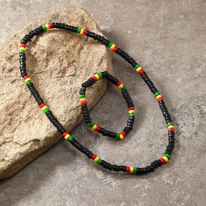 Bohemian colorful wood bead necklace and bracelet set on natural stone background