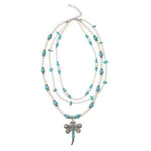 Three-layer bohemian necklace with turquoise beads, pearls, and a vintage dragonfly pendant