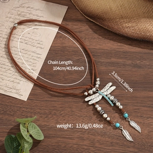 Bohemian vintage dragonfly necklace with turquoise beads and feathers on brown suede cord