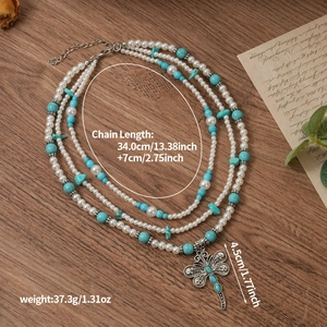 Bohemian multilayer necklace with faux pearls, turquoise beads and dragonfly charm