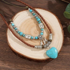 Bohemian double-layer necklace with turquoise heart pendant and silver feather charms
