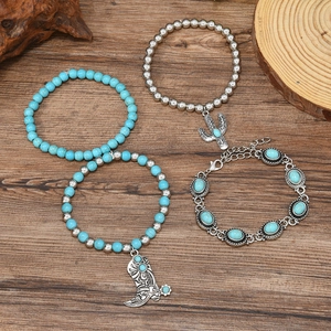 4pcs bohemian turquoise bead bracelets set with cactus and cowboy boot charms on wood