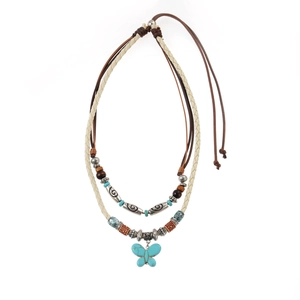 Double-layered bohemian necklace with turquoise butterfly pendant and ethnic beads