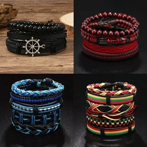 Detail view of retro braided PU leather bracelets with skull beads and metal charms
