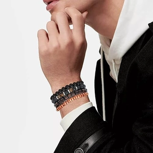 Set of 4 men's beaded bracelets featuring tiger eye stones and wood beads on wrist
