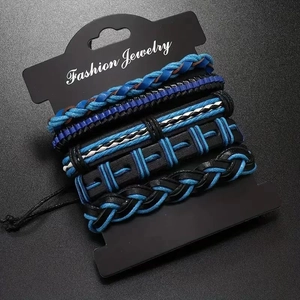 Close-up of 5-piece multilayer braided men's bracelets in blue, black, and white tones