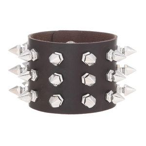 Macro detail of deep brown leather punk bracelet with three rows of silver metal studs