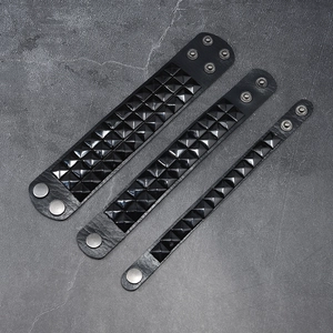 Three-piece punk black leather bracelet set with square metal studs and snap closures
