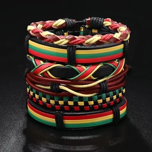 Macro detail of Rasta style multi-layer braided leather and cord bracelets set