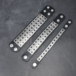 Punk black leather bracelet set with silver star rivets in three adjustable widths