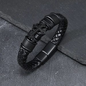 Men's braided leather bracelet with black metal cross charm and industrial style clasp
