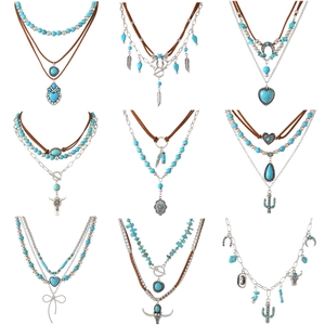 Boheemse meerlagige kettingset met turquoise kralen en vintage zilveren hangers