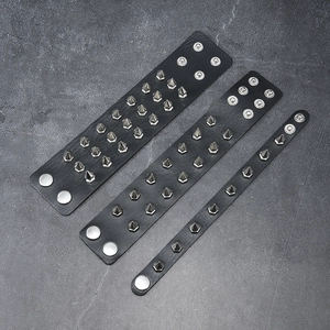 Set of 3 black leather studded punk bracelets with metallic cone rivets and snap closure
