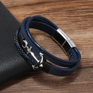 Detail of nautical anchor multi-layer braided leather bracelet with silver metal clasp