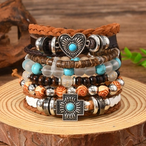 Bohemian multi-layer wrap bracelet featuring turquoise beads and vintage heart cross charms