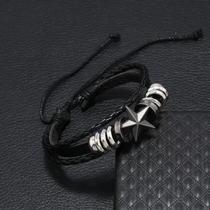 Braided black leather bracelet with vintage silver star charm and adjustable cord strap