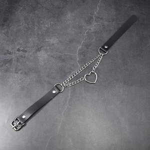 Detail view of Harajuku punk black leather choker with heart pendant and silver chains