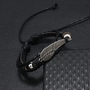Adjustable black leather bracelet featuring vintage silver alloy wing charm and beads