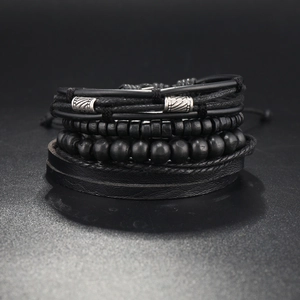Detailed close-up of multilayer punk bracelet set featuring leather bands and metal accents