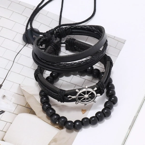 Men's multilayer black leather bracelet set featuring a silver nautical helm pendant