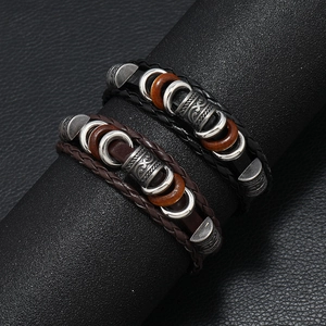 Vintage braided leather bracelets in black and brown with bohemian metal beads decoration