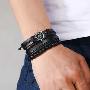 Men's multilayer black leather bracelet featuring a silver nautical helm charm and beads