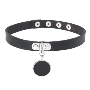 Detail of black leather choker featuring silver round pendant and adjustable buckle holes