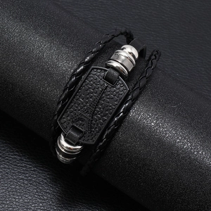 Men's multilayer black leather braided bracelet with embossed Eiffel Tower metal plate