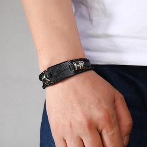 Multi-layer braided black leather bracelet for men featuring an Eiffel Tower metal plate