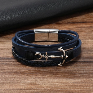 Macro detail of men's multilayer blue leather anchor bracelet with silver magnetic clasp