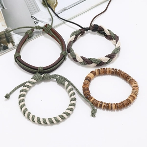 Set of four men's handmade braided leather bracelets with wooden beads in bohemian style