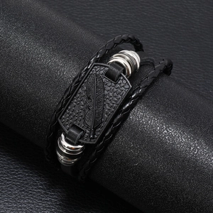 Men's multilayer punk leather bracelet featuring a black feather tag and silver rings