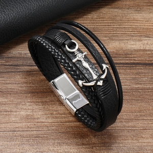 Men's multilayer braided leather anchor bracelet with silver magnetic buckle on wood surface