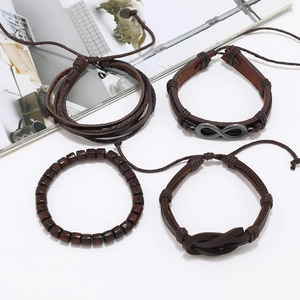 Detailed set of four men's vintage brown leather bracelets with an infinity symbol