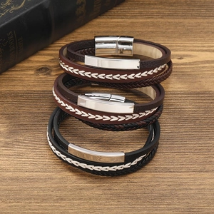 Men's retro multilayer braided leather bracelets with metallic magnetic clasps on wood