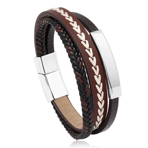 Close-up of multilayer braided leather bracelet with silver magnetic clasp and metal plaque