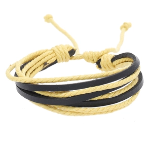 Close-up of multilayer braided bracelet with yellow wax cord and black faux leather