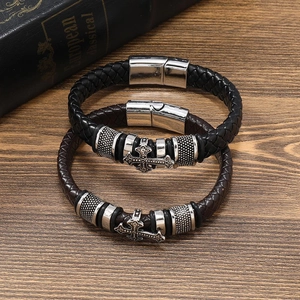 Set of two men's woven leather bracelets with vintage cross charms and magnetic clasps
