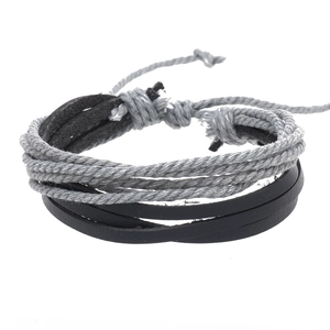 Detailed close-up of multilayer braided leather and hemp rope bracelet with adjustable knot