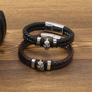 Men's braided leather skull bracelets in black and brown with magnetic clasp closures