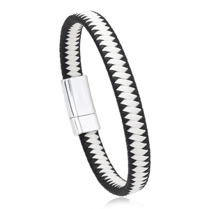 Close-up of black and white braided leather bracelet with polished silver magnetic clasp
