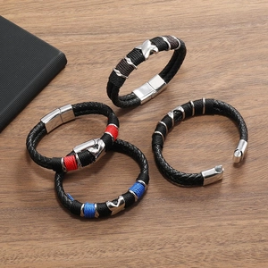 Men's multilayer braided leather bracelets with metallic magnetic clasps on wood