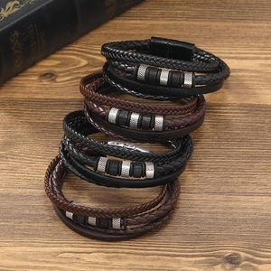 Close-up of multilayered braided leather bracelets for men with magnetic metal clasps