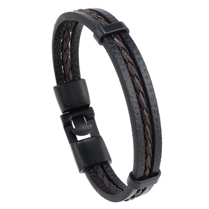 Close-up of multilayer braided leather bracelet with black magnetic metal clasp